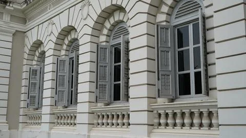 Architectural Details of a Building Facade with Arched Windows Stock Photos