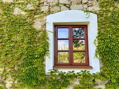 Architectural details of a medieval structure in the warm summer sunset Stock Photos