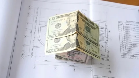 Architectural drawing and dollar money Stock Footage 84924099