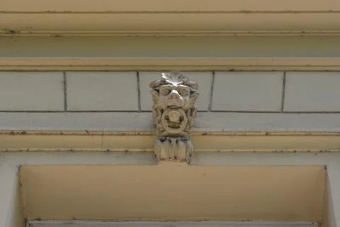 Architectural element of a gargoyle grotesque face on a historic building f.. Stock Photos