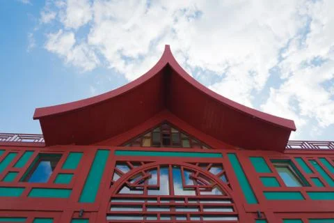 Architectural elements of a Southeast Asian building. Roof close-up. Against  Stock Photos