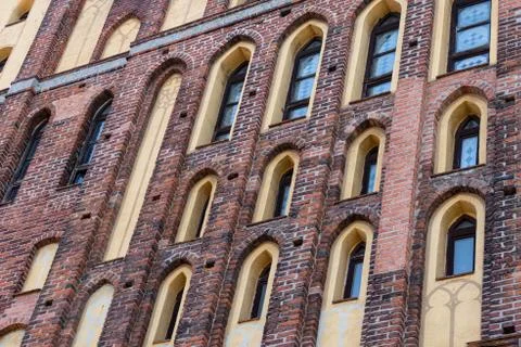 Architectural elements, vaults and windows of gothic cathedral. Red Brick wal Stock Photos