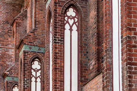 Architectural elements, vaults and windows of gothic cathedral. Red Brick wal Stock Photos