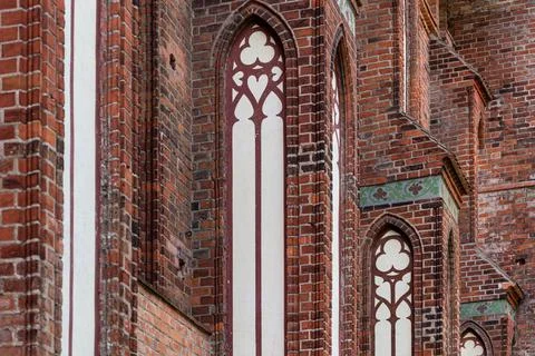 Architectural elements, vaults and windows of gothic cathedral. Red Brick wal Stock Photos