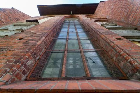 Architectural elements, vaults and windows of gothic cathedral. Red Brick wal Stock Photos