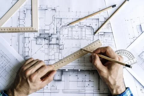 Architectural engineering design plan drawing on the table. Architect's work on Foto stock