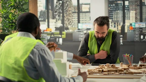 Architectural experts and contractors discussing construction and property Stock Footage 320031919