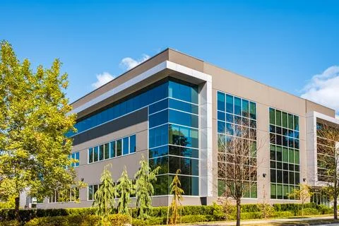 Architectural facade building with of glass elements. Exterior of a modern in Stock Photos