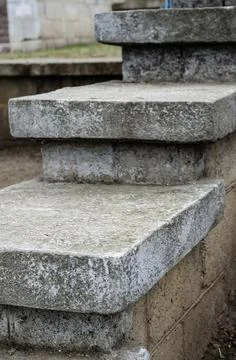 Architectural geometric composition with gray concrete rectangular steps. Stock Photos