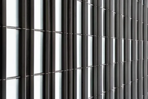 Architectural grid pattern style window background of the side of a building Stock Photos