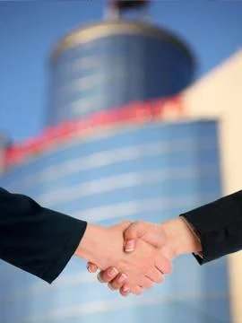 Architectural Handshaking in front of building Stock Photos