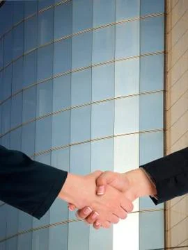 Architectural Handshaking in front of building Foto stock