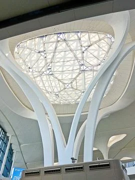 An architectural low-angle view showcases massive, organic white curves swirling Stock Photos