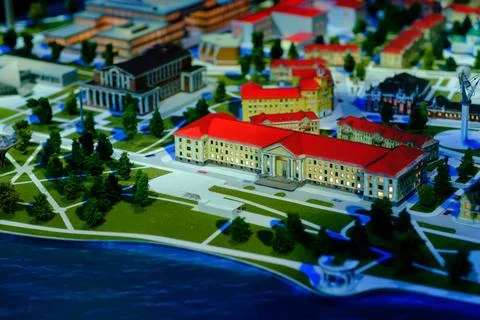 Architectural model of a cityscape featuring buildings, roads, and greenery.. Stock Photos