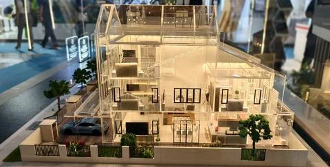 Architectural model of a modern multi‑story house with transparent walls Stock Photos