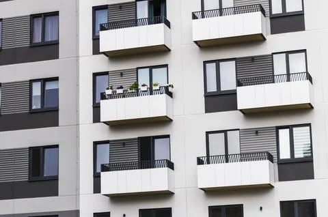 Architectural pattern of modern apartment building facade with minimalist w.. Stockfoto's