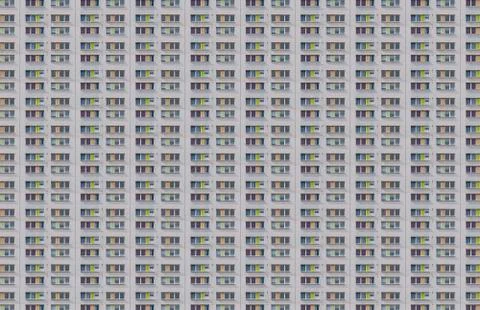 Architectural pattern, window facade with green and orange shutters Stock Photos