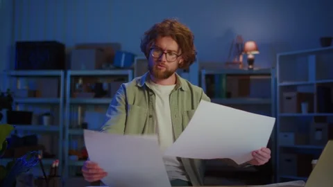 Architectural Planning. Focused Professional Man Reviewing Large Blueprints Stock Footage 318360108