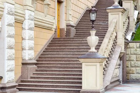 Architectural stone staircase with railings and balustrades with a pedestal. Stock Photos