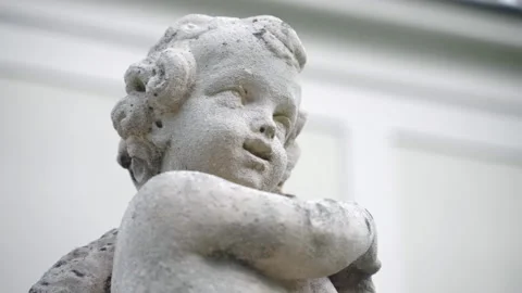Architectural stone statue of unrecognisable child decorating front or back yard Stock Footage 171948174