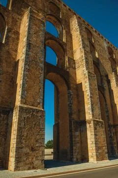 Architectural structure of aqueduct with arches Stock Photos