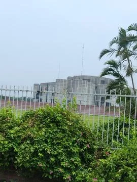 Architectural Structure Viewed Through Metal Fencing Stock Photos