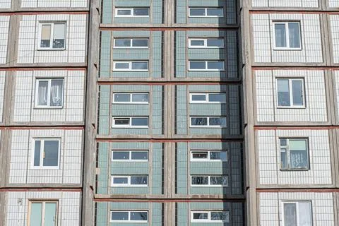 Architectural texture - multi-storey concrete panel apartment building lined  Stock Photos