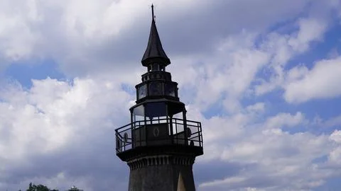 Architectural Tower Against Cloudy Sky Stock Photos