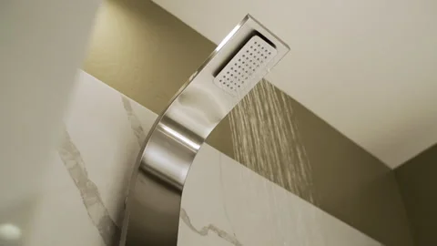 Architectural View of Curved Stainless Shower Against Marble Tile - Slow Pan Stock Footage 344082646