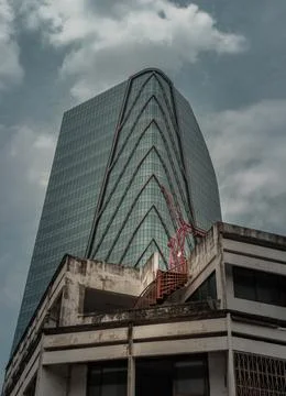 Architectural View of Overlapping Modern high building exterior and Old house 스톡 사진