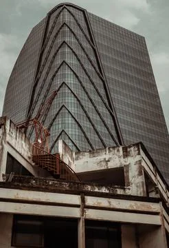 Architectural View of Overlapping Modern high building exterior and Old hou.. Stockfoto's