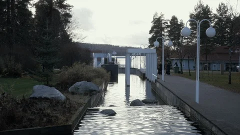 Architectural Water Stream reflecting light on a Gloomy Autumn Day Video stock 115122933