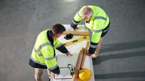 Architecture, above and men with blueprint in meeting for planning, renovation Stock Footage 341661246