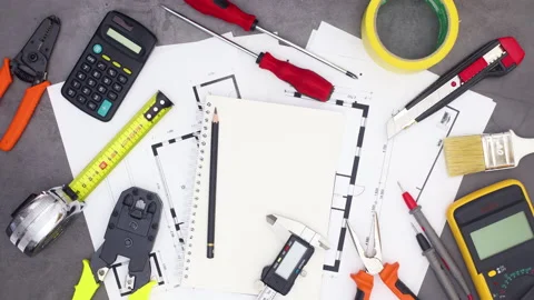 Architecture and construction tools appear on work table. Stop motion Stock Footage 136914502