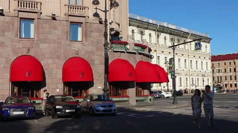 Architecture and red canopies over the windows of the Astoria Hotel Stock Footage 313446038