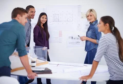 Architecture, blueprint and planning with developer team in office together for Foto stock