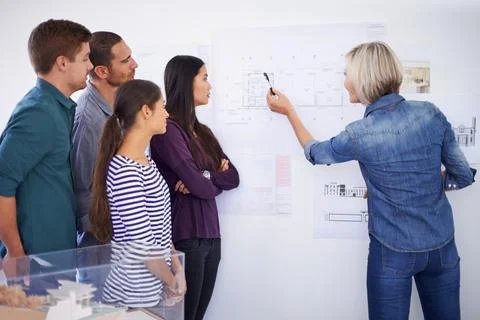 Architecture, blueprint and presentation with developer team in office together Stock Photos