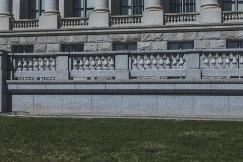 The architecture of buildings windows, stucco molding, and columns on a sunny Stock Photos