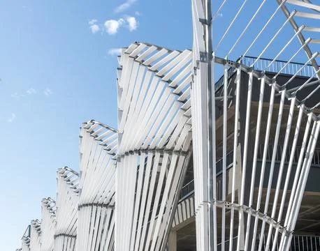 Architecture details, elements. Metal construction, sky. Rhythmic composition Stock Photos
