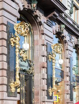 Architecture elements, lanterns and mascaron over the entrance to the Singe.. Fotos Stock
