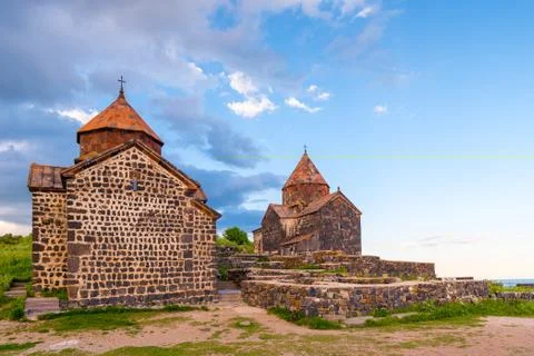 The architecture of the famous Armenian monastery Sevanavank in the rays of t 스톡 사진