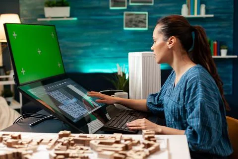 Architecture manager with design plan and green screen 스톡 사진
