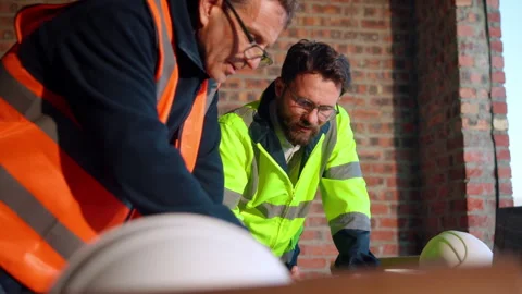 Architecture, people and talk at construction site with planning, collaboration Stock Footage 336203181