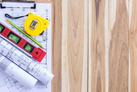 Architecture plan and rolls of blueprints with tool kit Foto stock