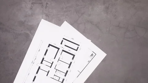 Architecture plans and construction tools appear on table, Stop motion Stock-Footage 136917464