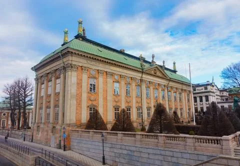 Architecture Of Stockholm, Sweden. Big yellow building with green roof Stock Photos