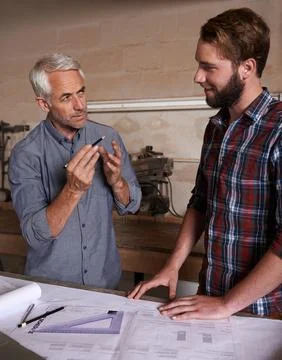 Architecture team, working on blueprint in workshop, designer and engineering Stock Photos