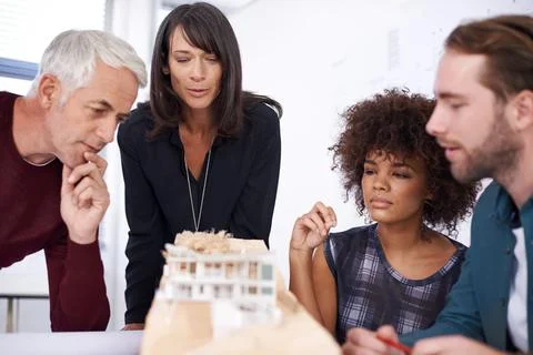 Architecture, teamwork and developer team with model in boardroom of office for Foto stock