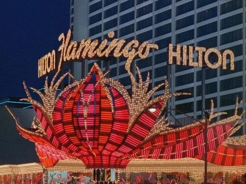 ARCHIVAL 35MM 2K EXT. DUSK- LAS VEGAS- FLAMINGO HILTON NEON SIGN CLOSE Stock Footage 75369701