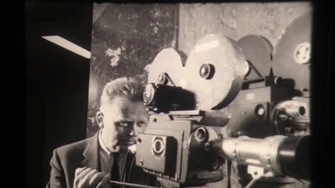Archival Footage of a Cameraman Recording on a Film Camera, Behind the Scenes Stock Footage 130174852